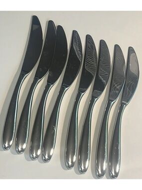 Set of 8 nambe Bend stainless table knives EUC